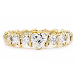 18ct gold diamond eternity ring, set with a single heart cut diamond of approx 0.50 carat ...