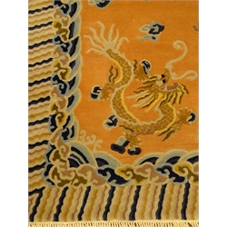  Chinese pink and blue ground wool rug, field of dragons, repeating border, 274cm x 183cm  