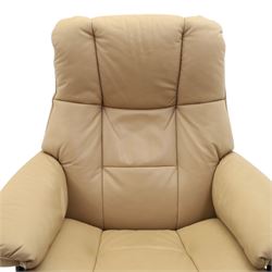 Ekornes Stressless - beech framed reclining swivel armchair with matching footstool, on U-shaped supports with circular bases, upholstered in beige leather