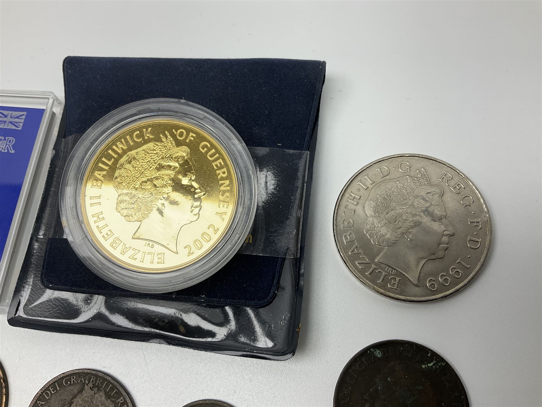 Two Great British Queen Elizabeth II five pound coins and a small number of other coins