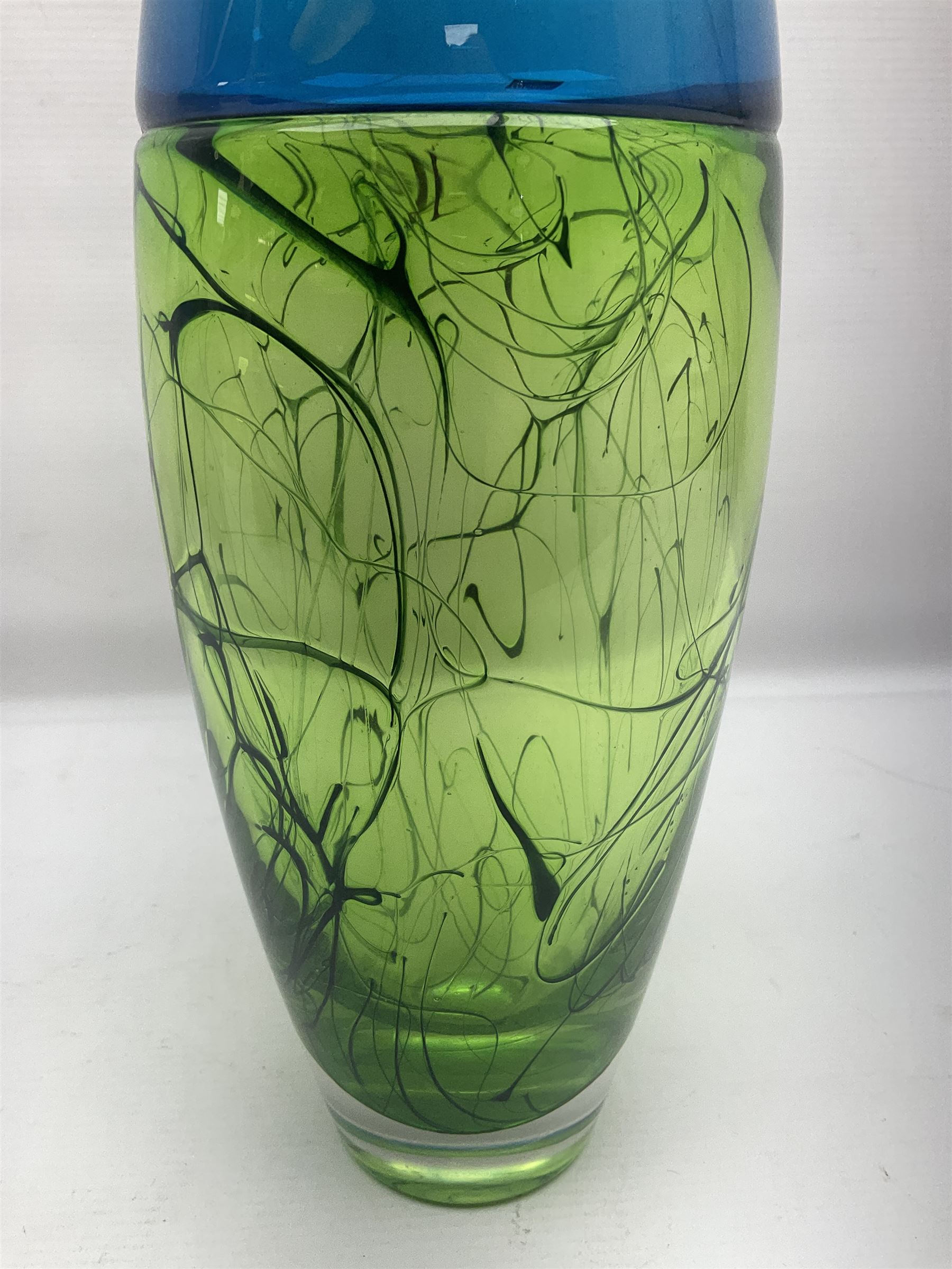 Stuart Akroyd glass vase, blue banded top and lime green lower section with free flowing line decoration, with sticker and engraved signature beneath, H29.5cm