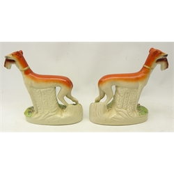  Pair of Victorian flat back Staffordshire greyhounds,holding rabbits in their mouths, H29cm     