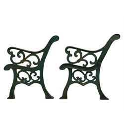 Pair cast iron garden bench ends decorated with scrolling design (H83cm), another pair of cast iron bench ends (H78cm), and a cast iron bench back decorated with foliage branches and roses (W110cm x H30cm)