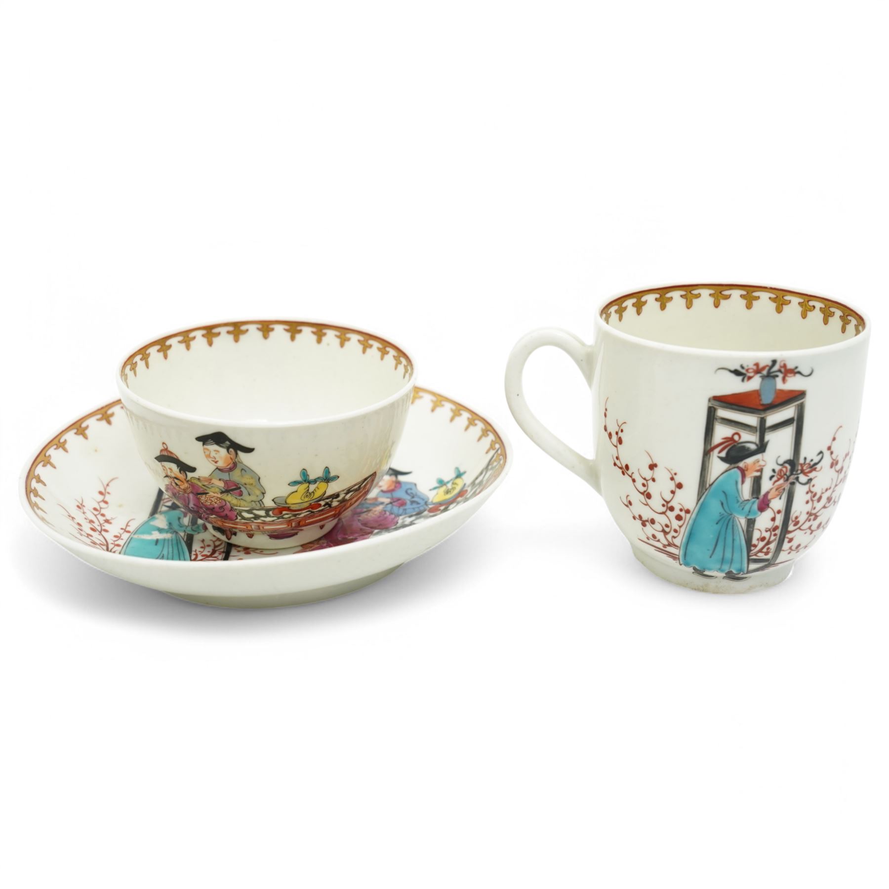 18th century Worcester trio, comprising coffee cup, small bowl and saucer, decorated with a Chinese scene of a flower seller in polychrome enamels, within gilt spearhead borders, saucer D12cm (3)