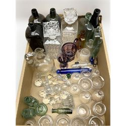 Quantity of glassware to include moulded faceted amethyst examples, rolling pin, bleeding cups, decanters and various stoppers etc in one box
