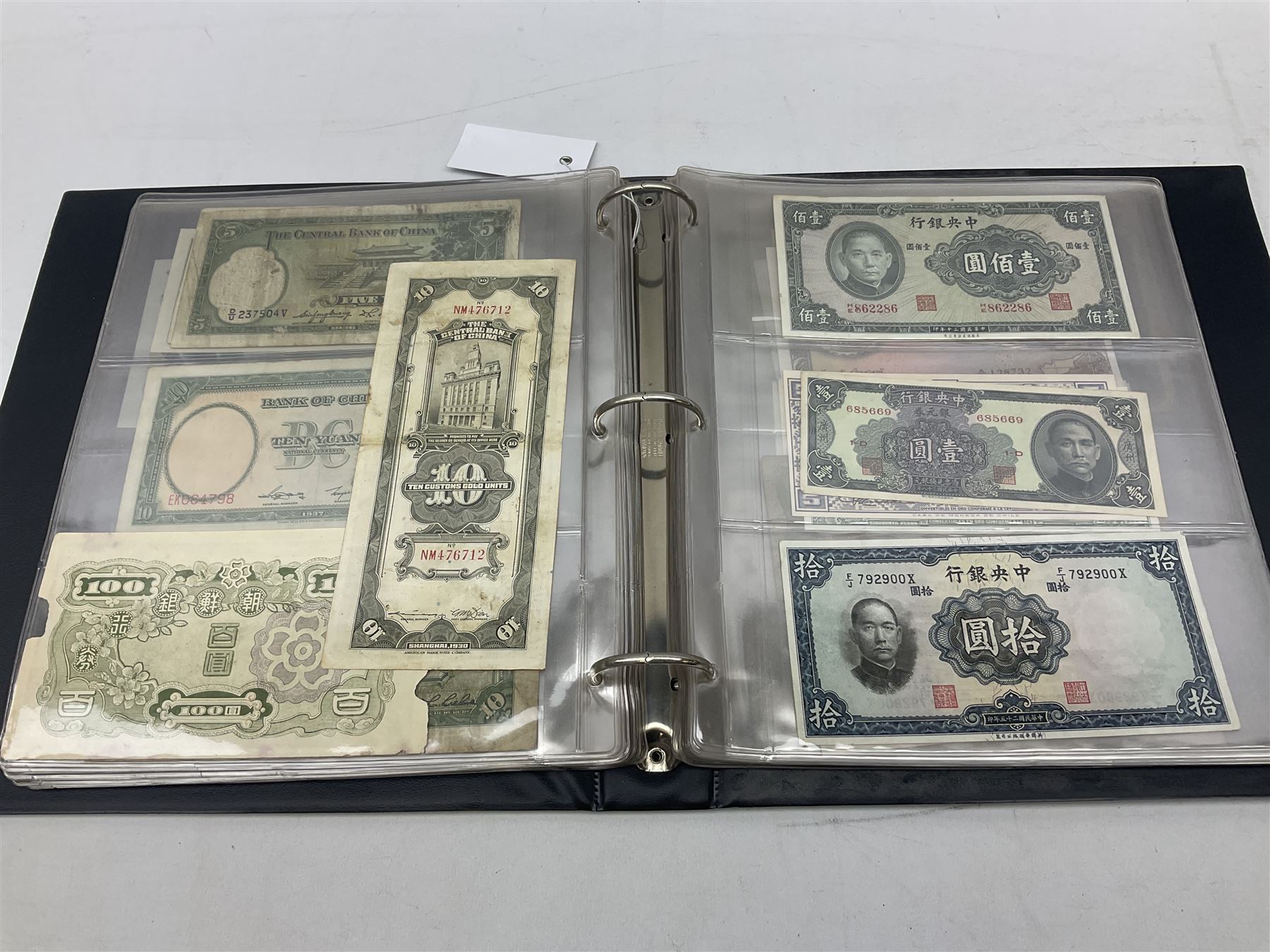 World banknotes, including Queen Elizabeth II The States of Jersey one pound 'DB202703', five pounds 'BB527762' and ten pounds 'AB651481', reserve bank of New Zealand two dollars '1L3 741894', King George V Straits Settlements one dollar 1st January 1935 'F/83 28924', various Bank of England notes etc, housed in two ring binder albums