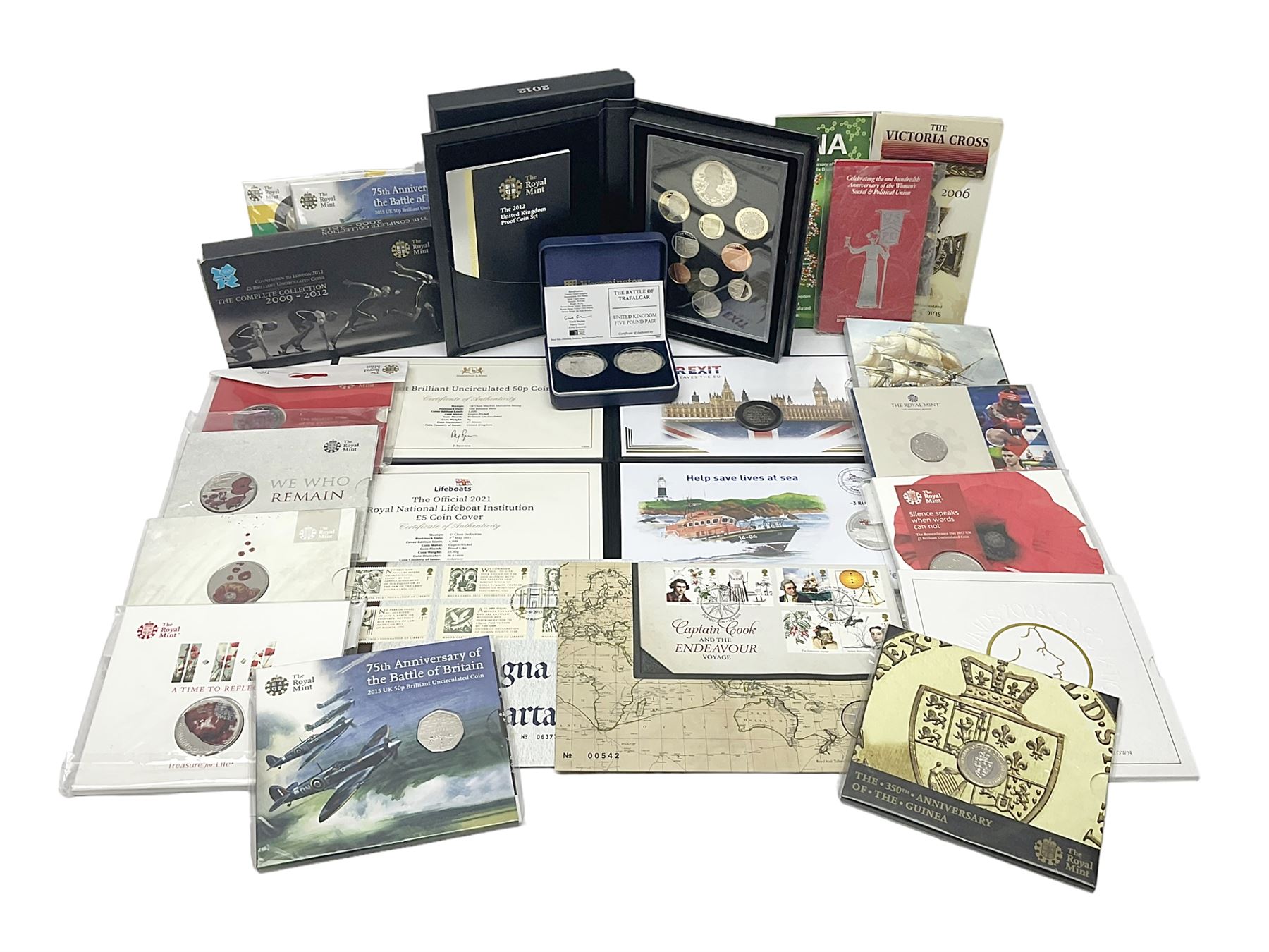 Mostly commemorative coinage, including various Queen Elizabeth II United Kingdom brilliant uncirculated fifty pence, two pound and five pound coins in card folders, The Royal Mint United Kingdom 2012 proof coin set, Alderney 2021 'Royal National Lifeboat Institution' five pound coin cover in Harrington and Byrne folder etc