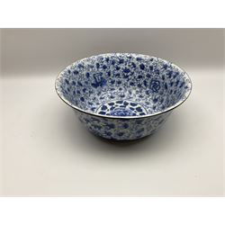 Large Chinese blue and white bowl with painted interior and exterior foliate design with interior central circular medallion enclosing a peony among foliage, with metal mounted rims, W37.5cm H15cm