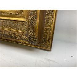 Composite marble effect plaque, depicting a Classical scene moulded in high relief, within heavy decorative gilt frame, H44cm W57cm