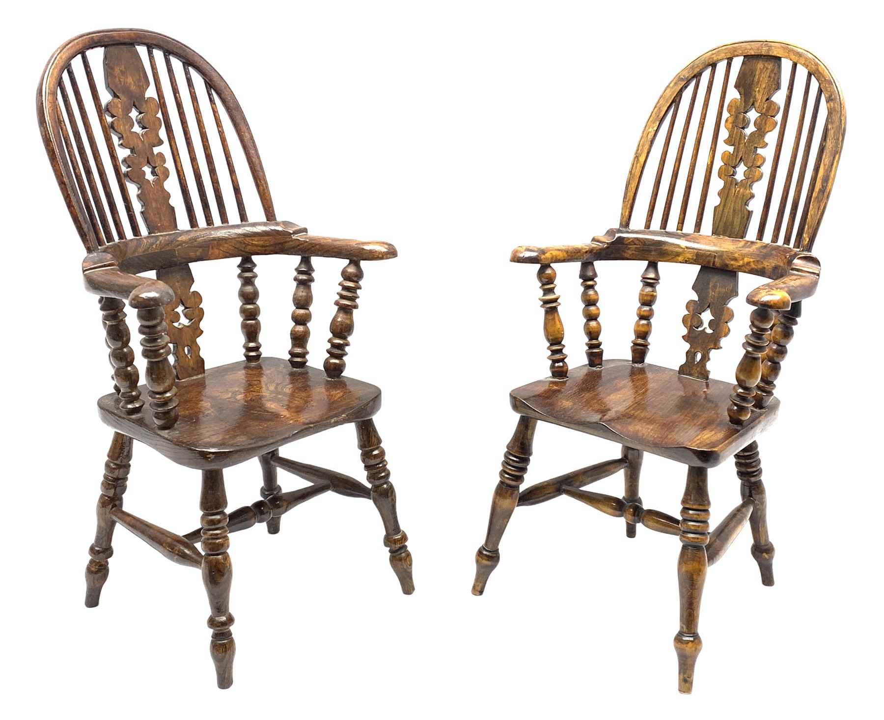 Matched pair elm miniature Windsor armchairs, high stick and pierced fretwork splat back, turned supports joined by H shaped stretchers