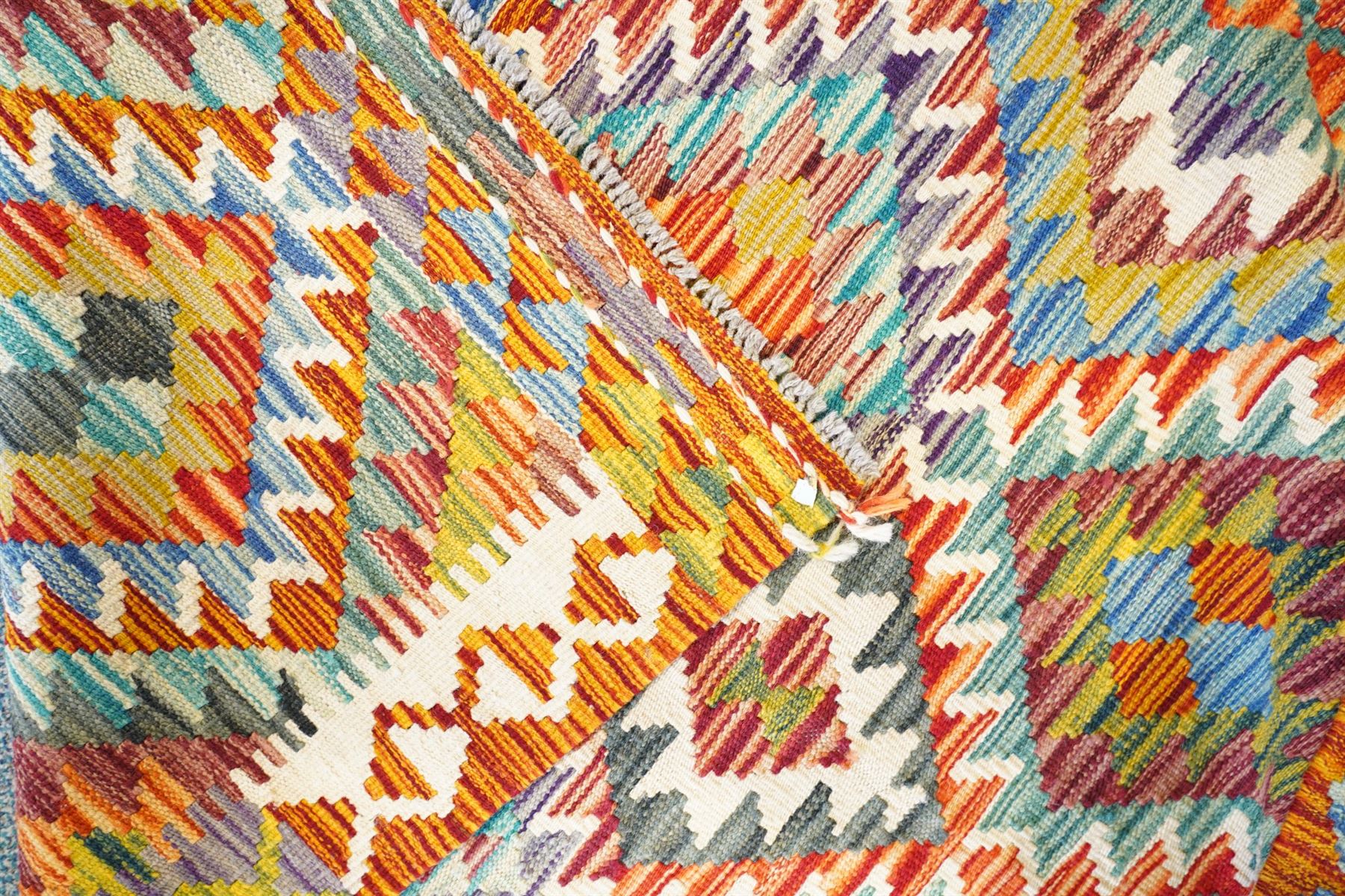 Chobi Kilim multi-coloured ground rug, stepped lozenges enclosed by hooked border 