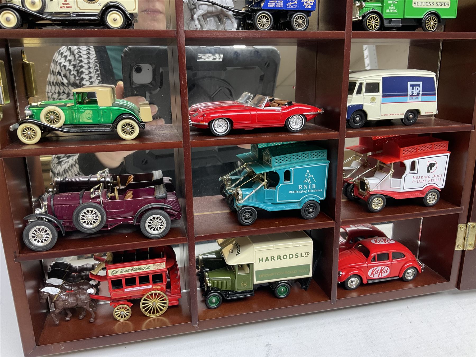 Collection of die-cast vehicles to include Corgi, Dinky, Lledo and Days Gone, housed in six wood display units