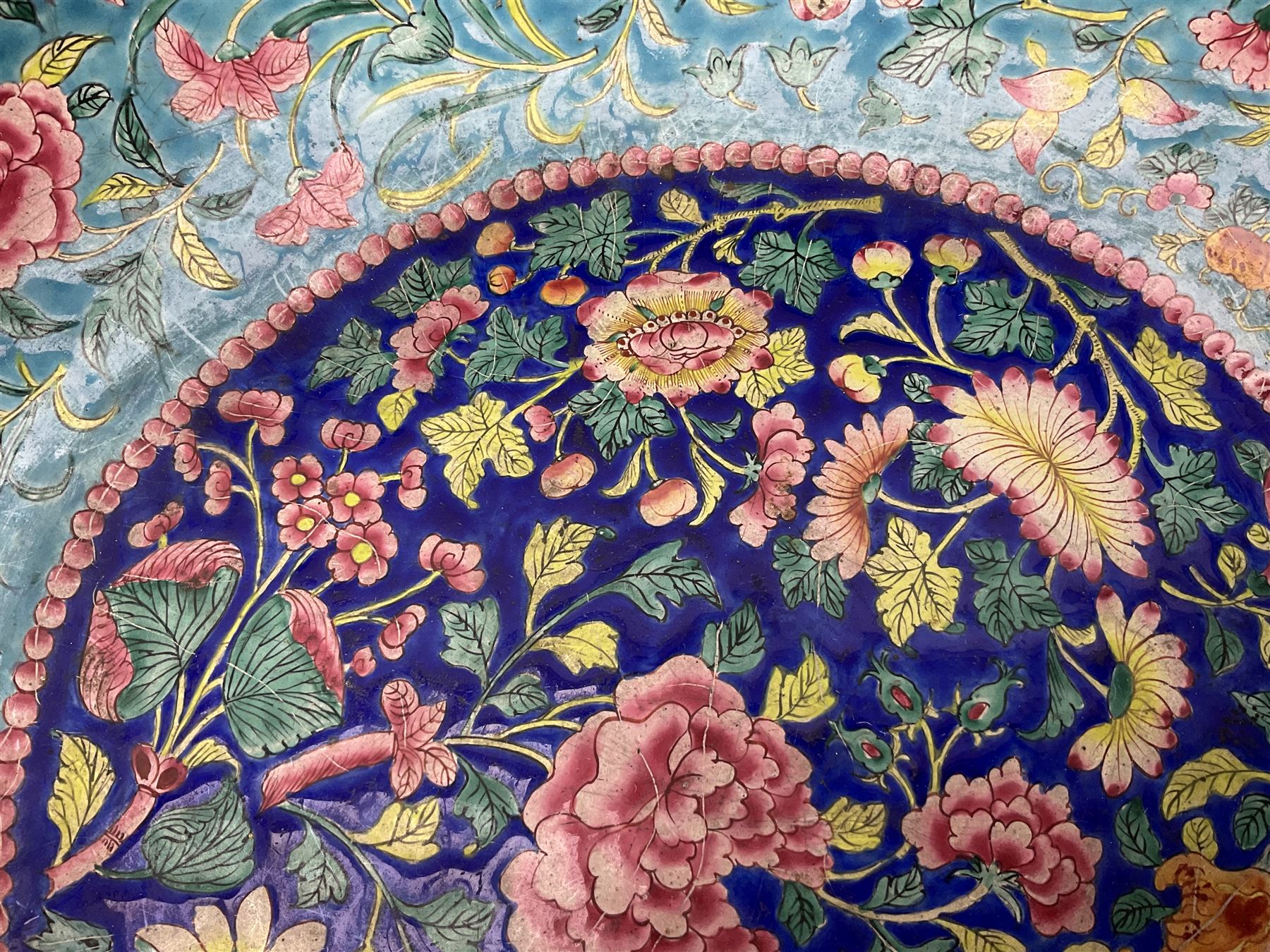 18th/19th century Chinese Canton enamel basin, the circular basin with flat everted rim, decorated with scrolling foliate and fruit decoration on a blue ground, D43cm