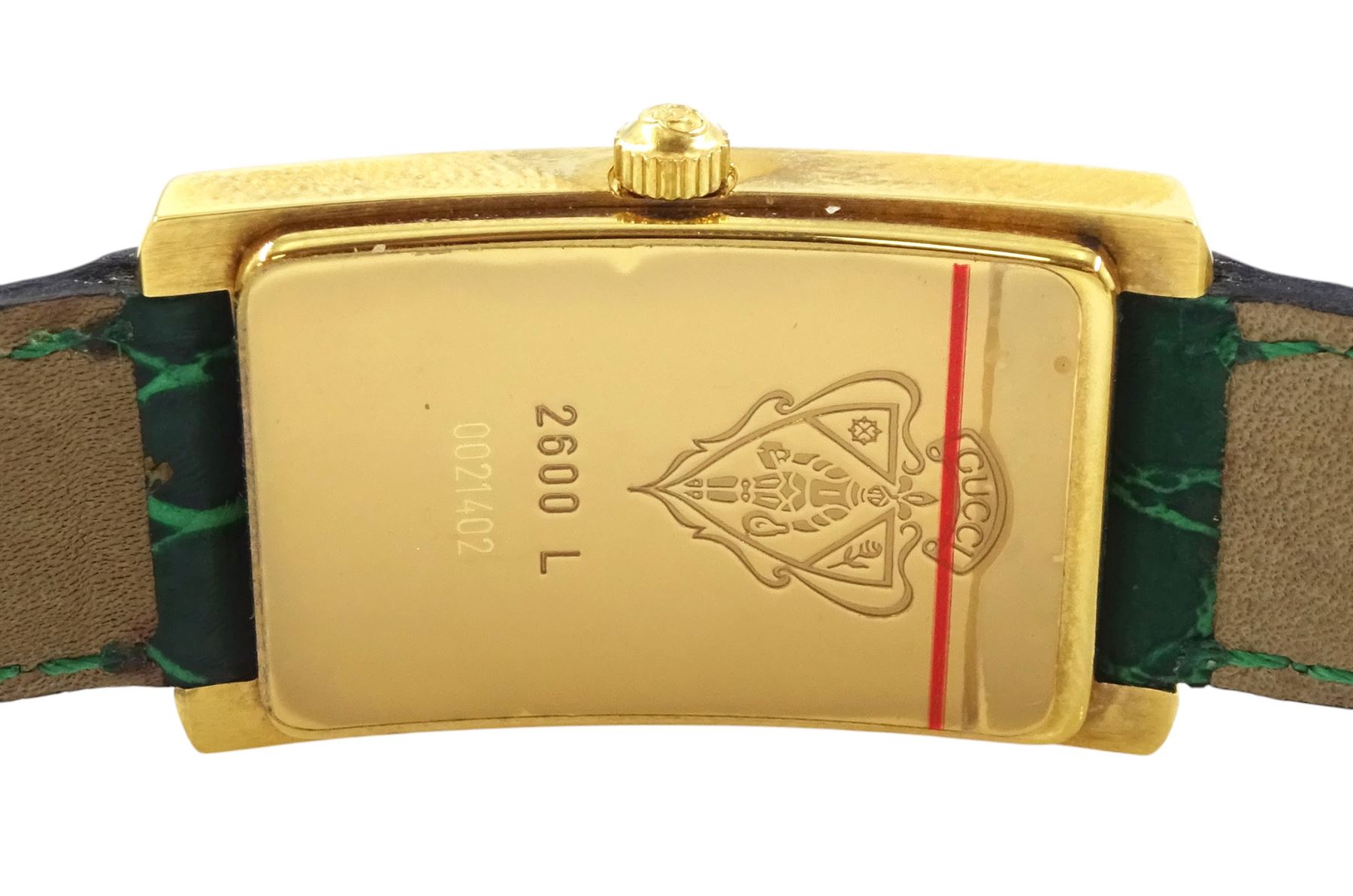 Gucci ladies gold-plated quartz wristwatch, Ref. 2600 L, silvered and green dial, on original green leather strap with gilt buckle, boxed
