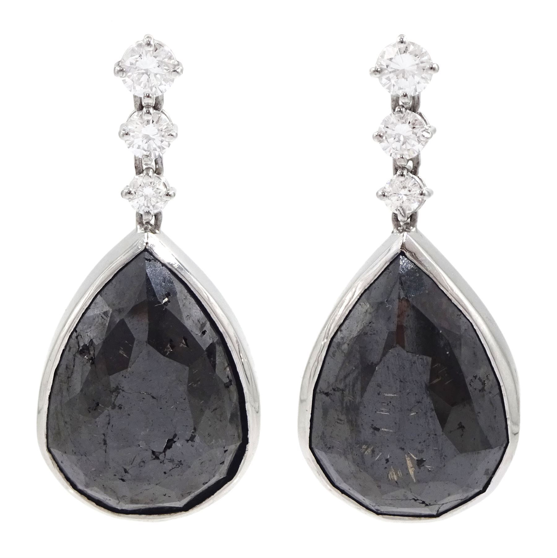 Pair of 18ct white gold black and white diamond pendant stud earrings, three graduating round brilliant cut diamonds suspending a single pear cut black diamond, hallmarked, total white diamond weight approx 1.05 carat, total black diamond weight approx 43.65 carat 