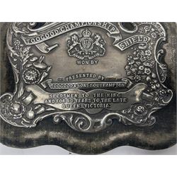 Silver presentation plaque, the Toogood Championship Shield, embossed with lion and flowers, mounted upon a velvet easel style support, hallmarked H17cm