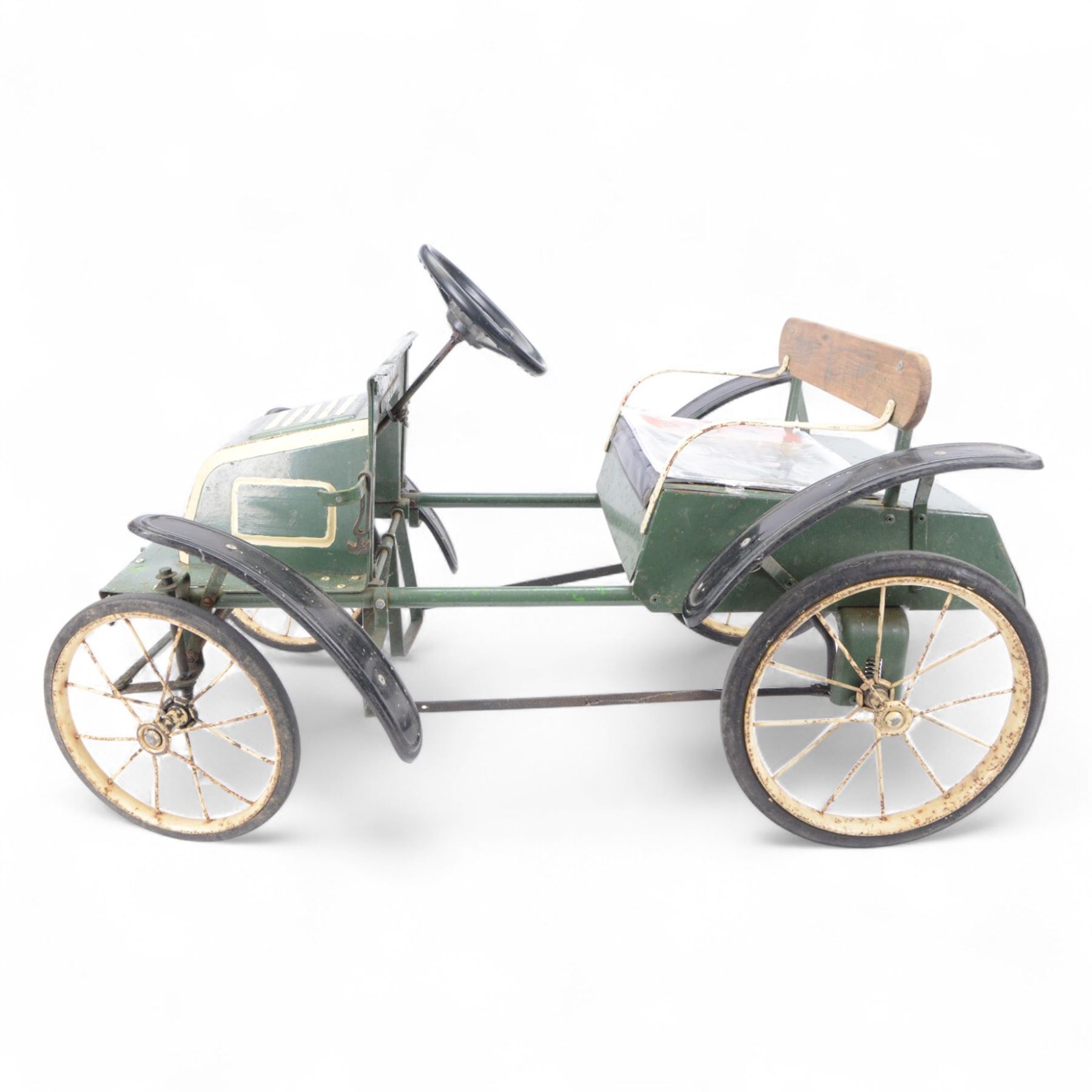 Triang child's pedal car in the style of a vintage automotive, likely a De Dion Bouton or an early Renault, painted in dark green with pale yellow details, H52cm
