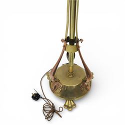 Arts and Crafts copper and brass standard lamp, in the manner of W A S Benson, slender tubular column with adjustable height mechanism, applied copper scroll brackets, circular weighted base with copper struts and stylised feet
