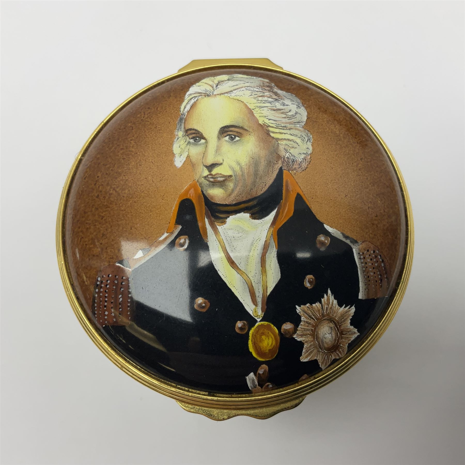 Halcyon Days bonbonniere, modelled as 'Vice-Admiral Lord Nelson', to mark the bicentenary of the British victory at the Battle of Trafalgar, together with another Halcyon Days enamel box depicting Lord Nelson, both boxed 