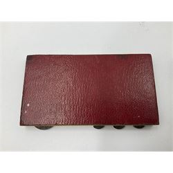 Edwardian silver mounted playing card case, hallmarked William Harrison Walter, Birmingham 1903, the sides each with a period playing card set behind a bevelled glass panel, the hinged cover with later engraving 'Presented to Norman T Crombie Esq by the officers & men of the 31st WR Detachment for services rendered 1917-1918', with red leather lined interior, the three compartments upon a sprung base and containing two later wooden Whist markers, case H12.5cm