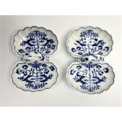 Three late 19th/early 20th century Meissen open double salts, comprising pair with shell shaped bowls and naturalistically modelled ring handle, decorated in underglaze blue in the Onion pattern, L11cm, and a single example with circular bowls and ring handle, decorated with birds and insects and heightened with gilt, L9.5cm, each with blue crossed sword mark beneath 
