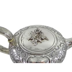George III silver teapot, squat form, embossed foliate decoration, leaf-capped handle by John Emes, London 1807 with later flower finial by Henry Holland, hallmarked, approx 16.5oz
