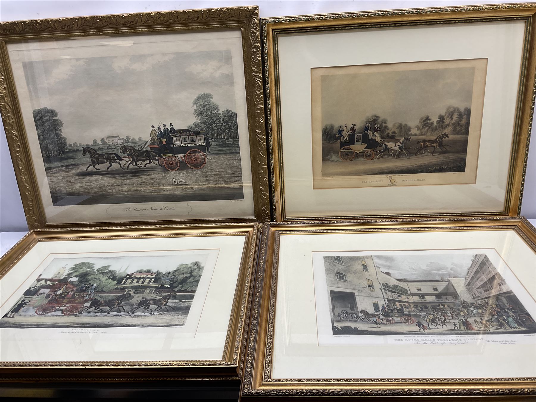 After James Pollard (British 1792-1862): 'The Taglioni Windsor Coach'; 'Royal Mail Coach'; 'The Royal Mails Preparing to Start' and 'The Unicorn Norwich Coach', set four 19th coloured engravings pub. 1824-1837 max 43cm x 59cm (4)