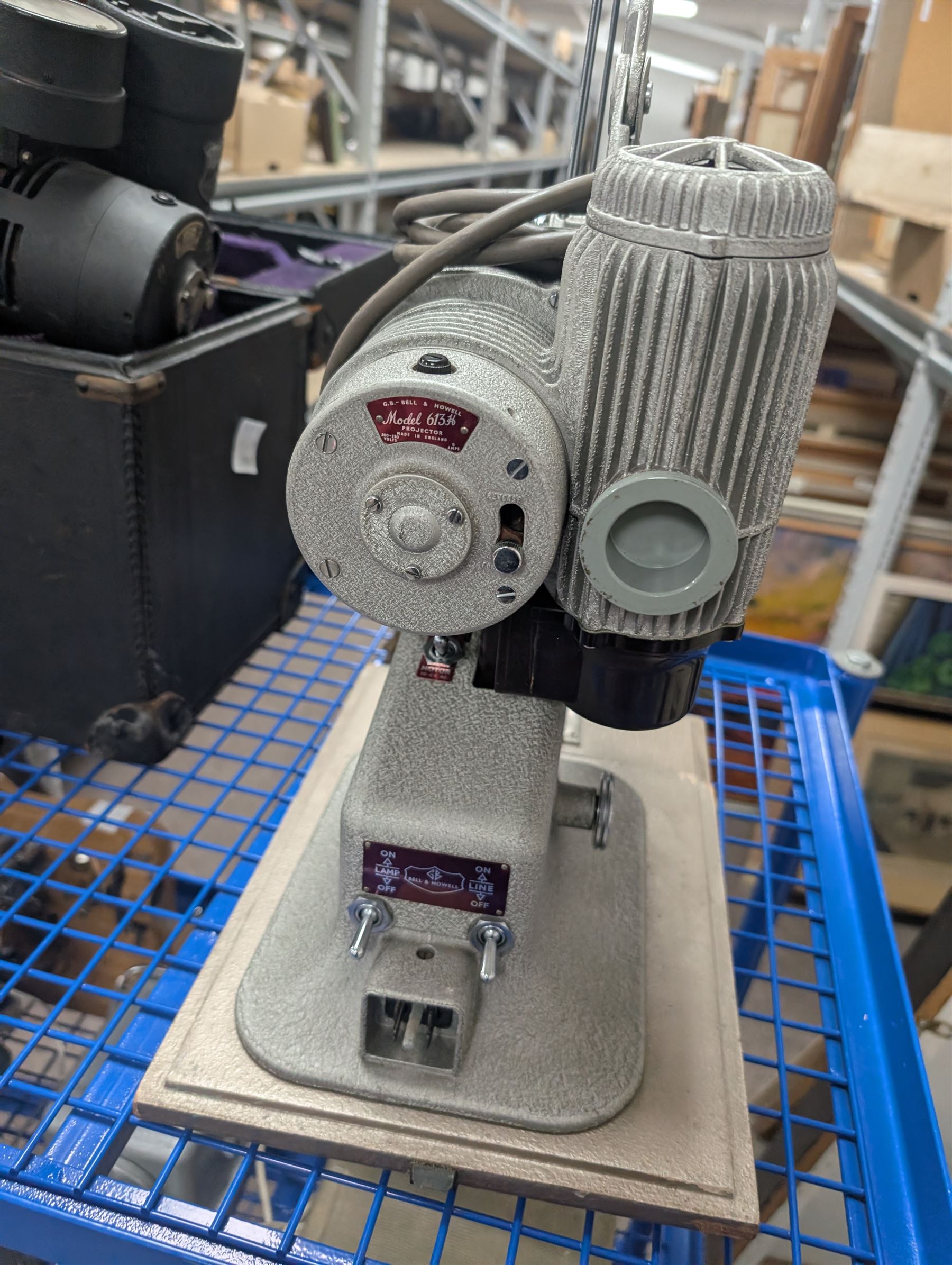 Collection of projectors, including Bell & Howell 613 cine projector, E J Arnold slide projector, Bolex home projector, Aldis 303, Bell & Howell Filmo 57 model projector, Leitz Wetzlar Pradovit Color, Kodak Instamatic M55L movie projector and a Gnome slide projector