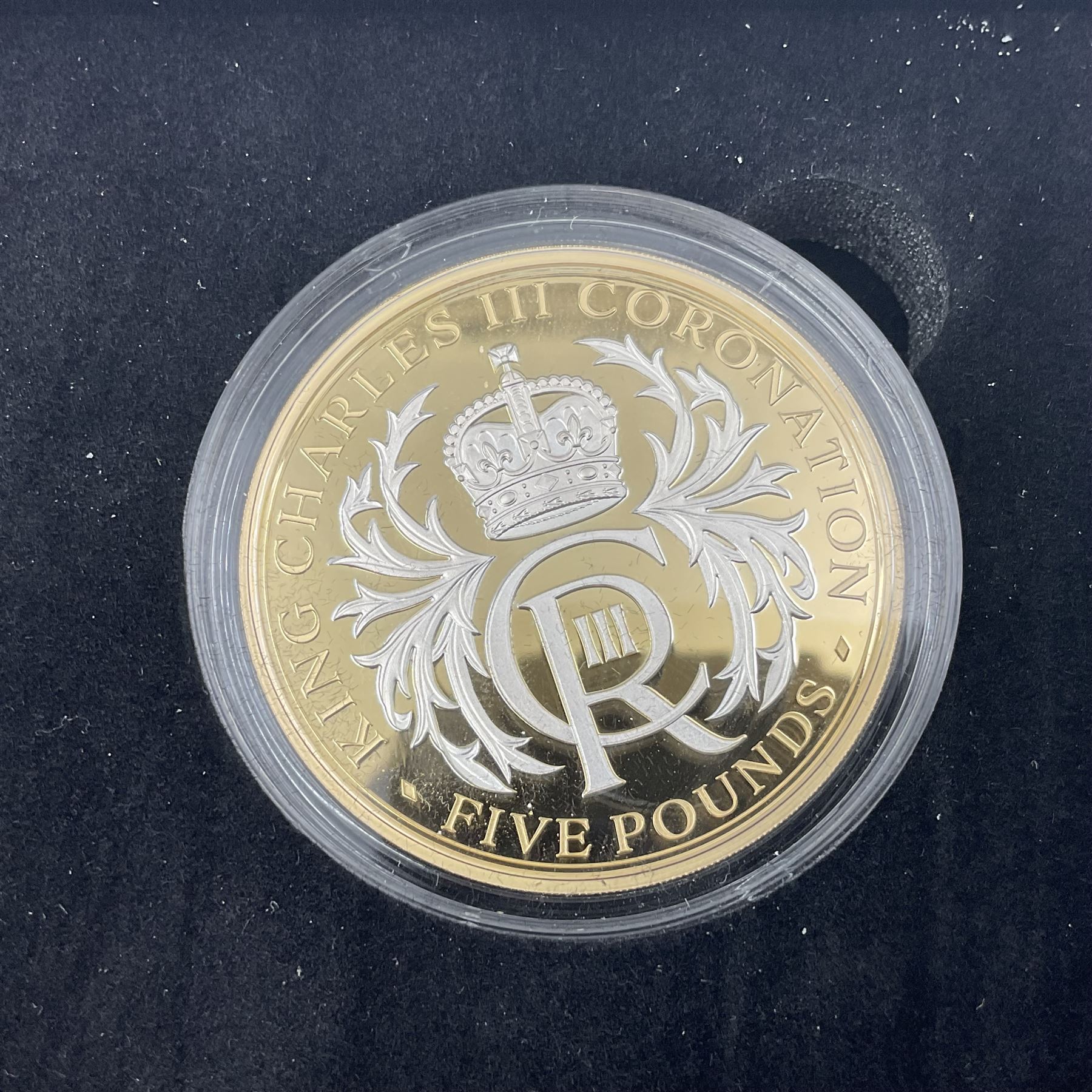 King Charles III 2023 'Coronation Silver Proof Mint Masters Set' comprising Bailiwick of Jersey, Bailiwick of Guernsey and Isle of Man sterling silver proof five pound coins, cased with certificate and Queen Elizabeth II 2019 Bailiwick of Jersey 'Remember With Us' silver two pound and five pound pair, cased with CPM certificate