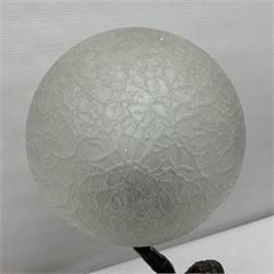 1930s Art Deco spelter table lamp, modelled as a nude woman holding aloft a spherical crizzled glass shade, upon a marble base, H48cm