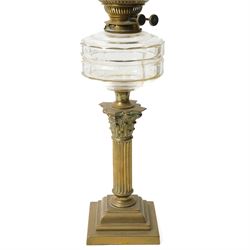 Pair of Victorian table oil lamps with clear glass reservoirs on brass Corinthian columns and stepped square bases with chimneys and etched glass shades H71cm overall
