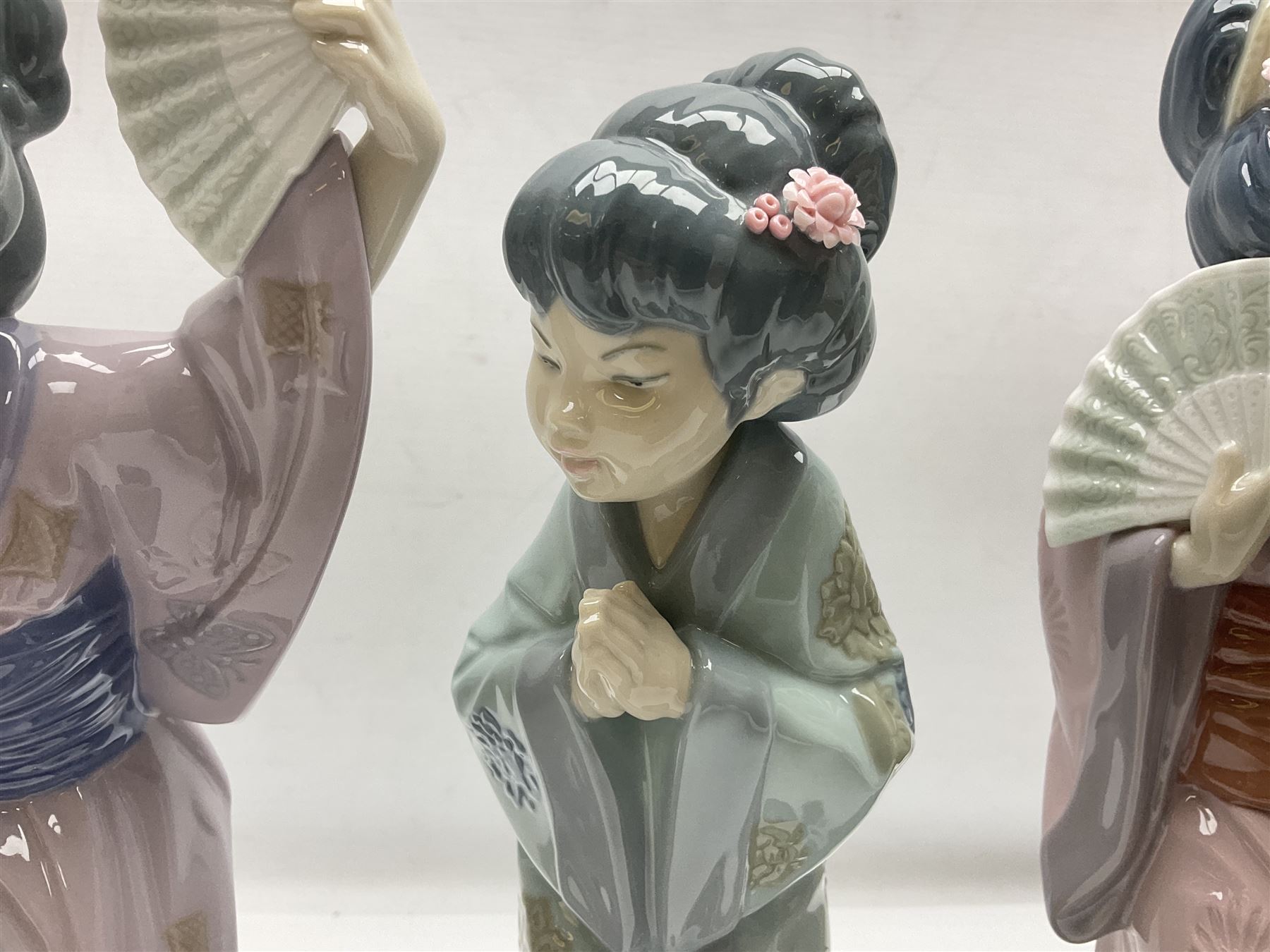 Three Lladro Japanese figures, comprising Sayonara no. 4989, Chrysanthemum no. 4990 and Madame Butterfly no. 4991, largest H30cm