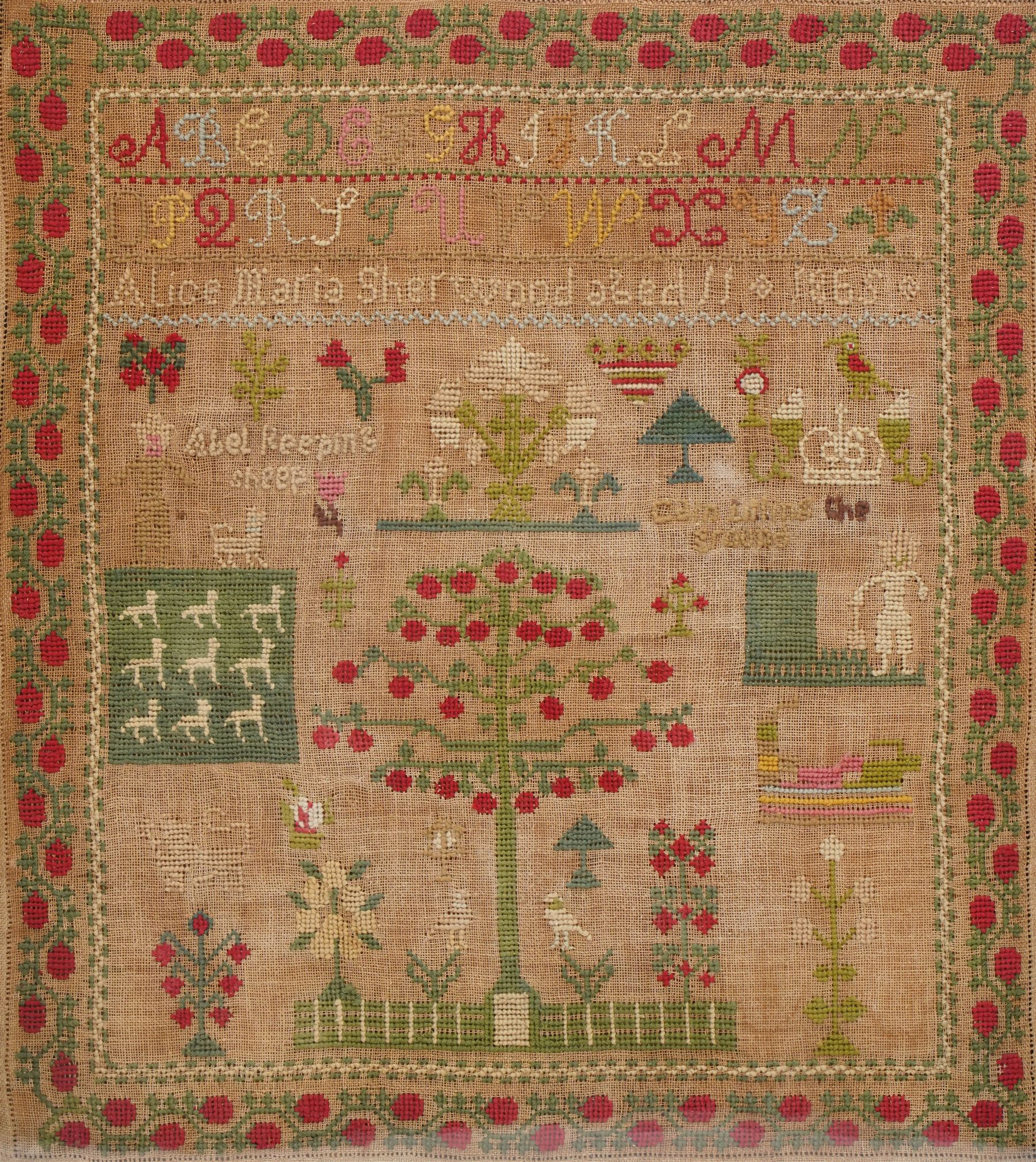 Victorian sampler by Alice Maria Sherwood aged 11, dated 1865, finely worked with religious scenes of 'Abel keeping sheep' and 'Cain tilling the land', decorated with apple tree motif within a floral border, 49cm x 43cm 