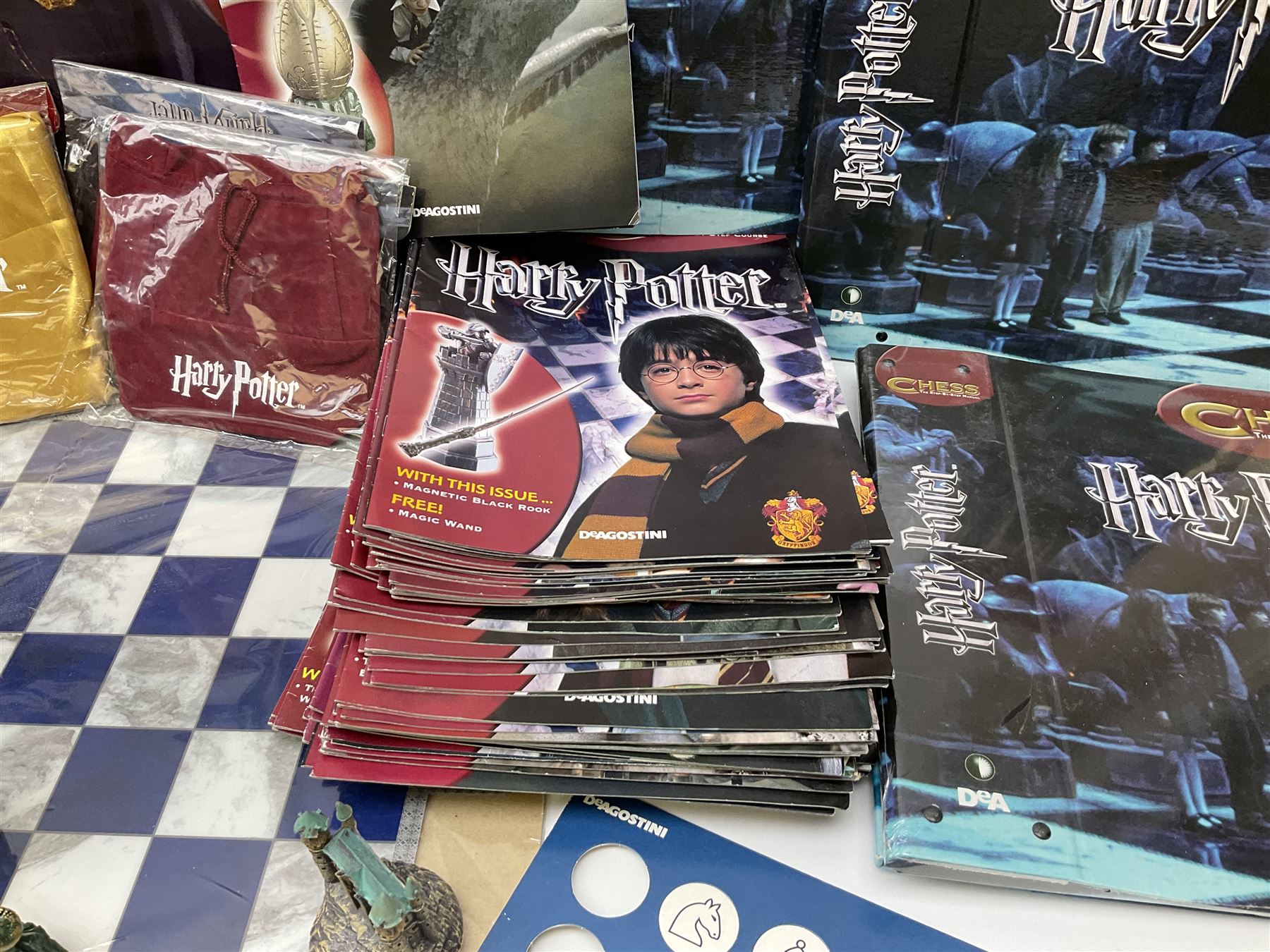 Complete DeAgostini Harry Potter chess step by step course with accessories, wand etc, including periodicals Nos. 1-82 (lacking No.68) with four binders, two chess sets with framed board, one traditional style the other fantasy, in original box.