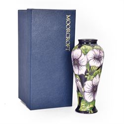 Moorcroft vase in Petunia pattern upon a
