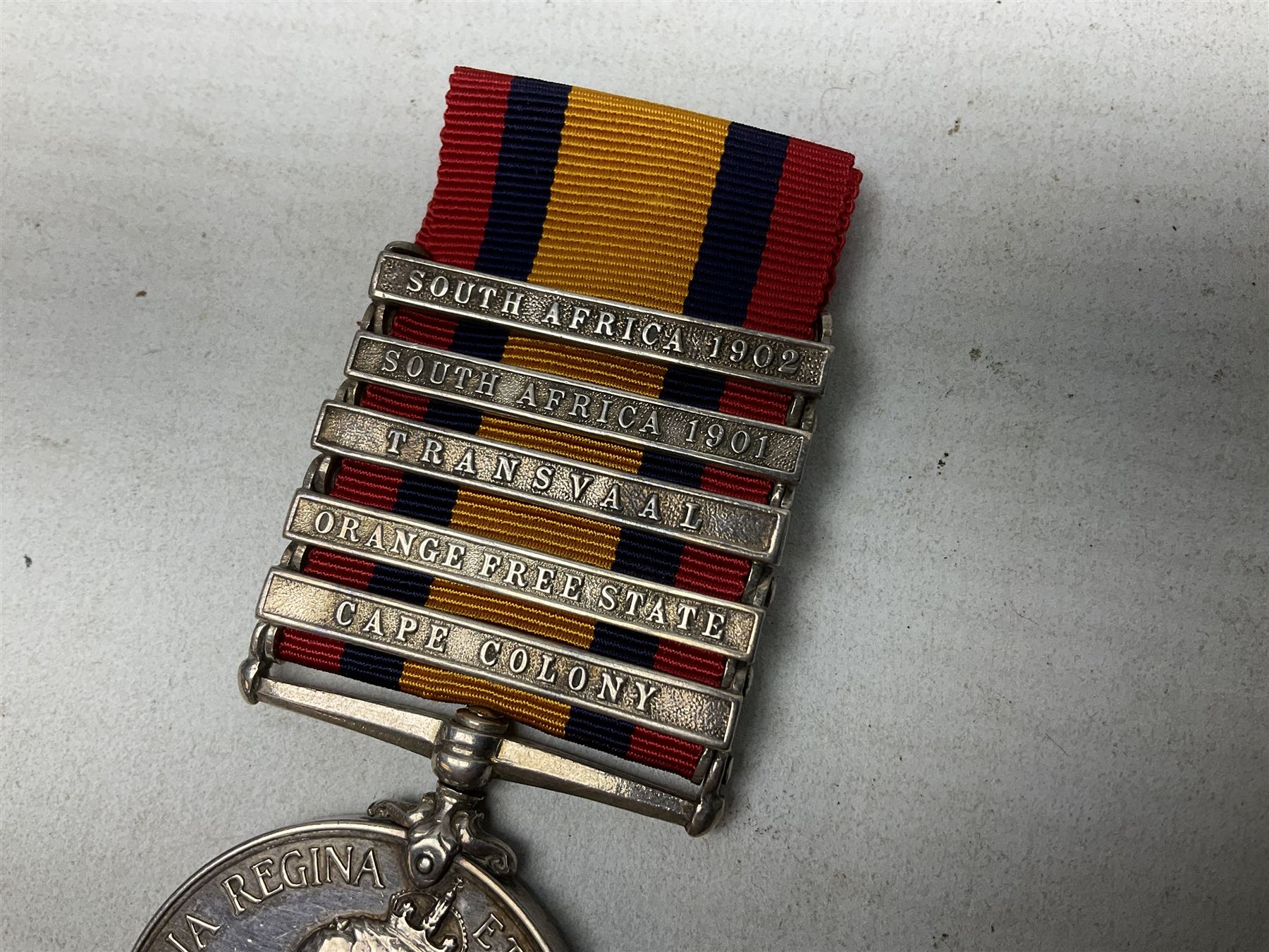 Queens South Africa Medal with five clasps for South Africa 1902/1901, Transvaal, Orange Free State and Cape Colony awarded to 4640 Pte. A. Farmer 1st Dgn. Gds. with ribbon and manuscript biographical details