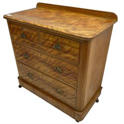 Victorian satin walnut chest, raised back over two short and two long drawers, skirted base with castors