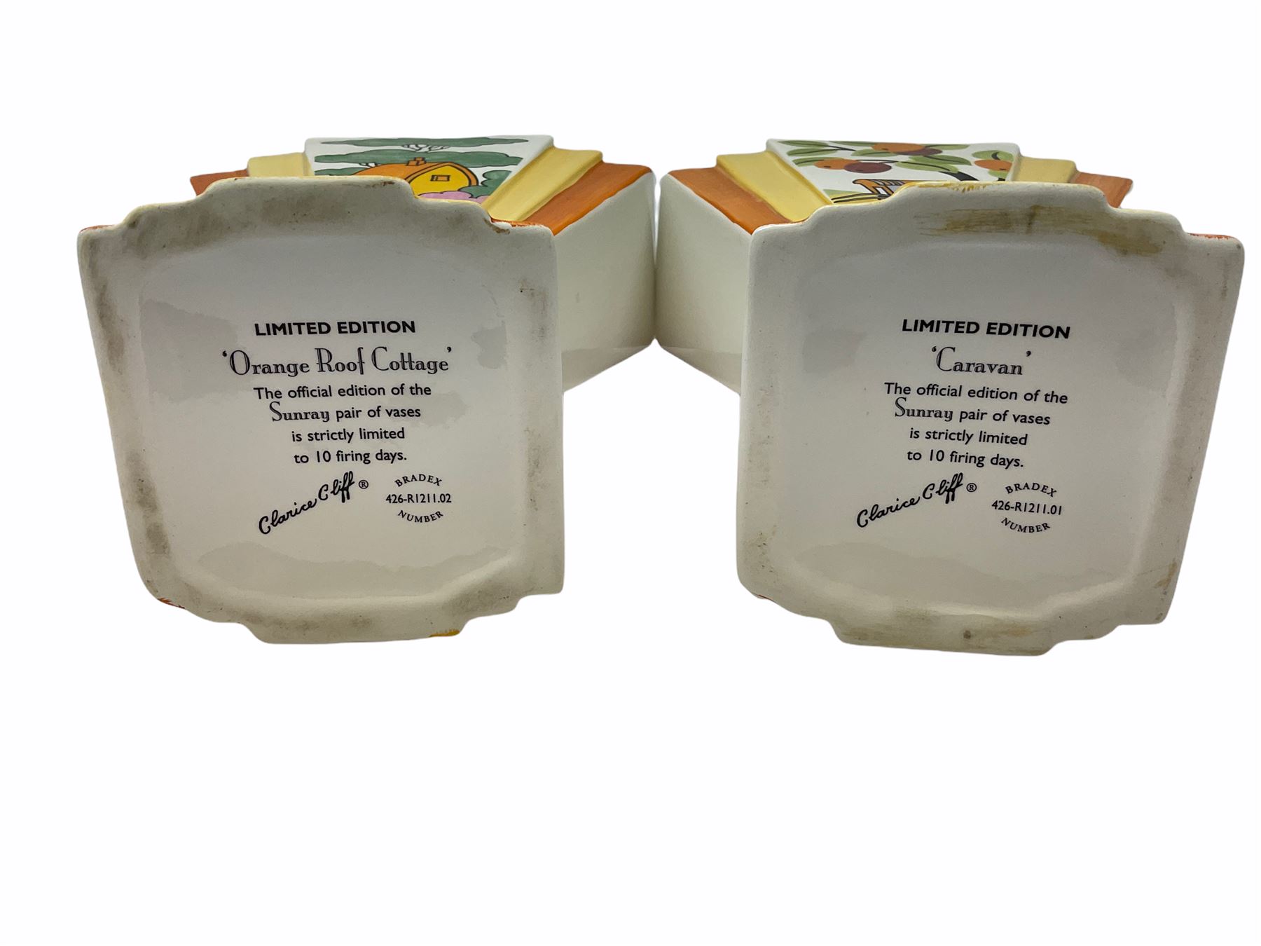Two Wedgwood Clarice Cliff sunray vases, in Caravan design and Orange Roof Cottage design, both limited edition, H21.5cm. 