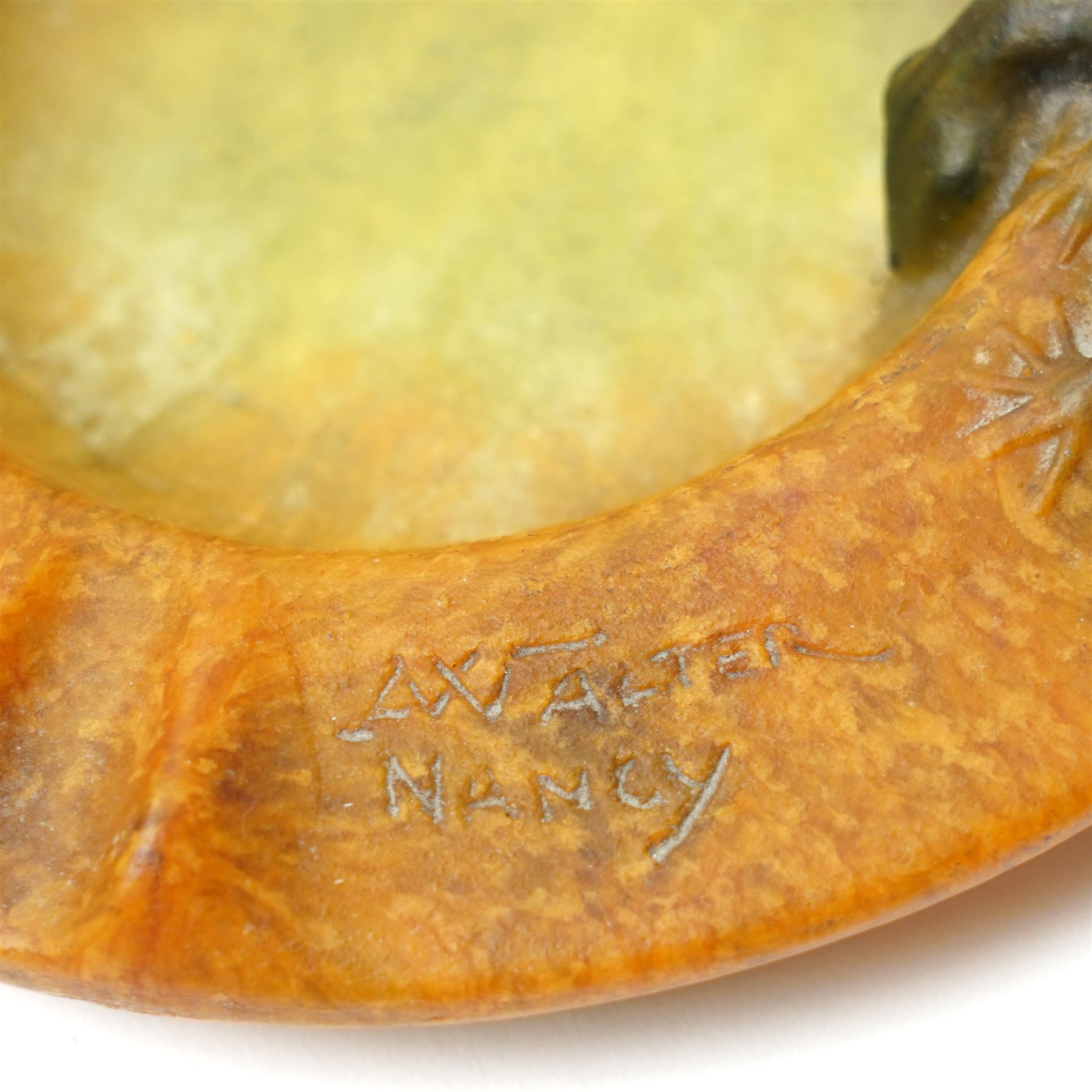 Amalric Walter (1870-1959) and Henri Berge (1868-1936), Nancy, France, circa 1920, pate de verre, Salamander ashtray, bearing moulded mark 'A Walter Nancy' and incised mark 'Berge sc.', D12cm

Note: Almaric Walter, born in Sèvres near Paris, exhibited at the Salon des Artistes Françaises in 1895 and 1903, and in 1908 moved to Nancy where he established his own workshop within the Daum glassworks. There he worked closely with Daum designers, including Henri Bergé. This ashtray is an example of Walter’s pâte-de-verre technique.

Provenance: From the collection of Andrew Chichester Everitt.