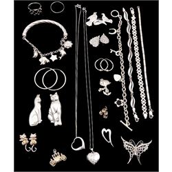 Collection of silver jewellery including moon and star bracelet, four other bracelets, Snoopy brooch, two rings, two pairs of hoop earrings, heart locket and two pendants etc
