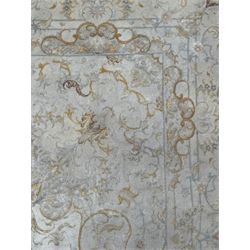 Persian Mahal densely knotted ivory ground carpet, floral rosette medallion surrounded by interlacing leafy branches and palmettes, scrolling border decorated with foliate motifs, within guard stripes, with signature panels to each end