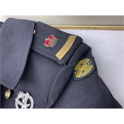 Clothing including tam o'shanter, glengarry with feather bearing Royal Regiment of Scotland badge, beret, jersey with 'The Green Howards B Company' stitching and another with 'Light Infantry' stitching, great coat and cap bearing Frontiersmen badges, trousers etc and a framed print displaying various badges of the Royal Navy