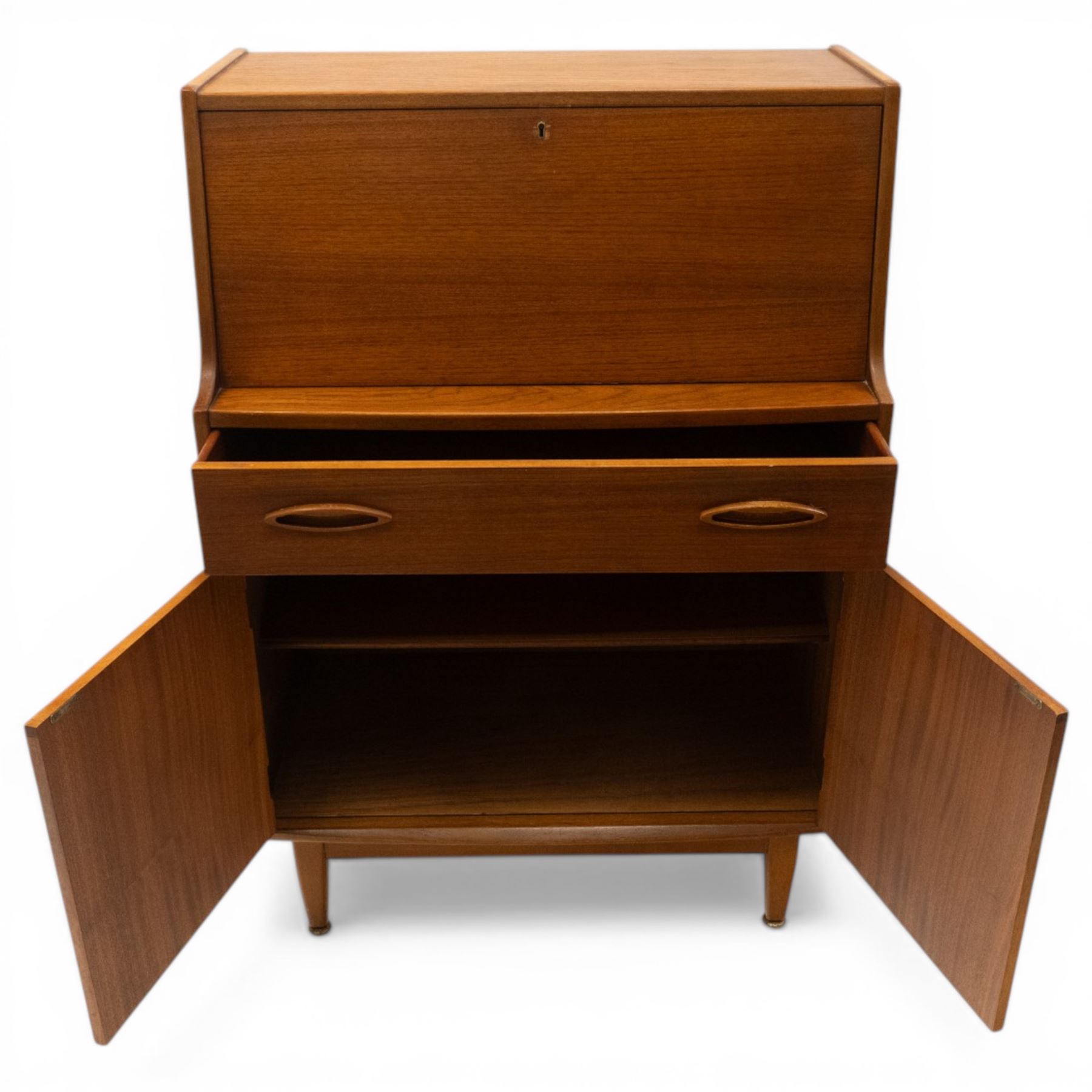 Jentique - mid-20th century teak bureau, fall-front enclosing fitted interior, over single drawer and cupboard fitted with inset handles, on cylindrical tapering feet