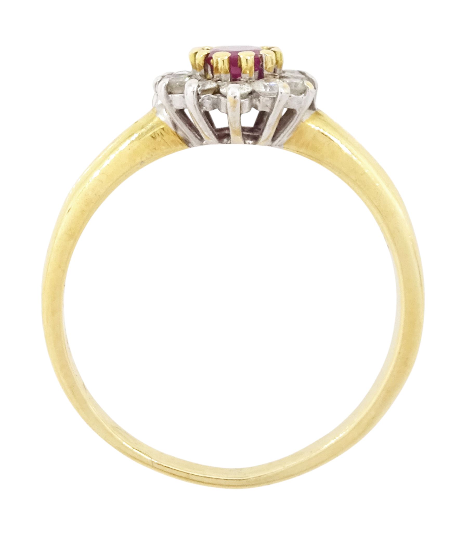 18ct gold ruby and diamond cluster ring, single oval cut ruby of approx 0.25 carat, surrounded by twelve round brilliant cut diamonds, hallmarked, total diamond weight 0.25 carat