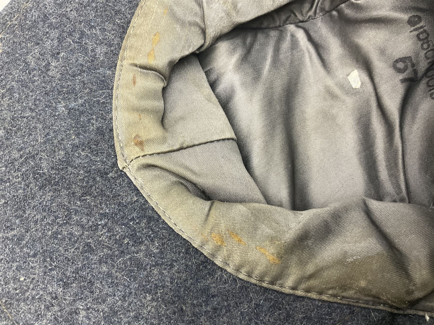 WW2 German Luftwaffe M43 field cap with triangular cloth eagle and roundel badge; marked '1944 ?/0501/0015 57'