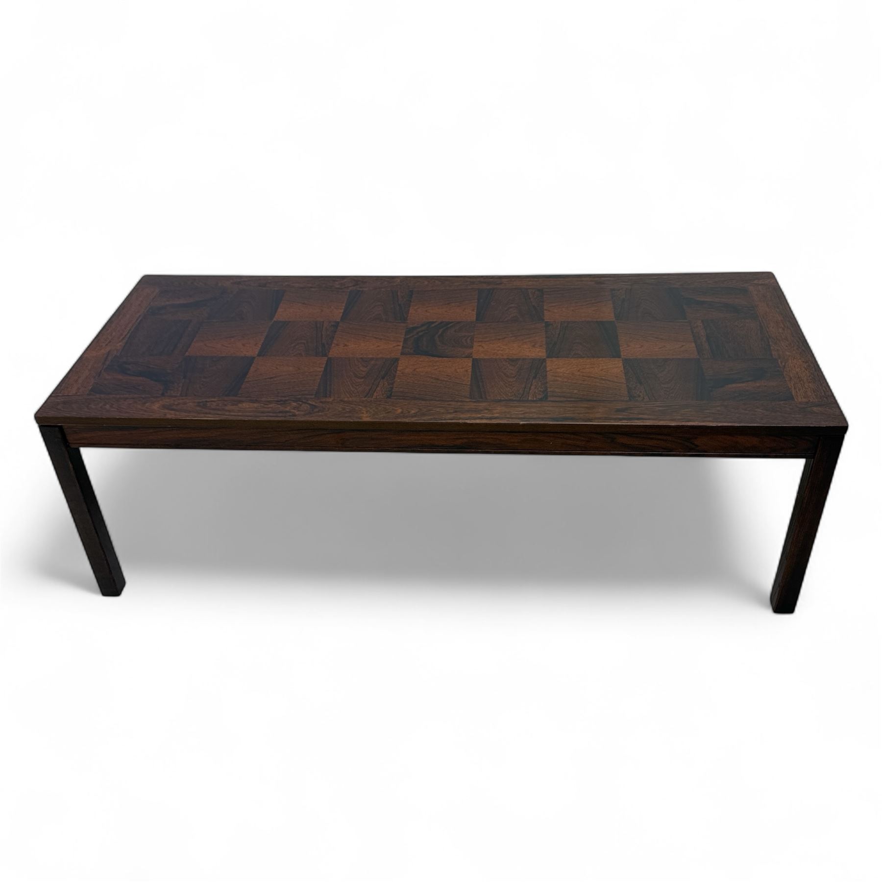 Heggen, Norway - 1970s parquetry veneered rosewood coffee table, the top with 'patchwork' parquetry design, raised on square-section supports