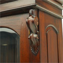 Victorian revival hardwood dresser, projecting moulded cornice above three glazed doors enclosing shelves, moulded top over three drawers and three panelled cupboard doors, flanked by applied carved scroll brackets, on plinth base,