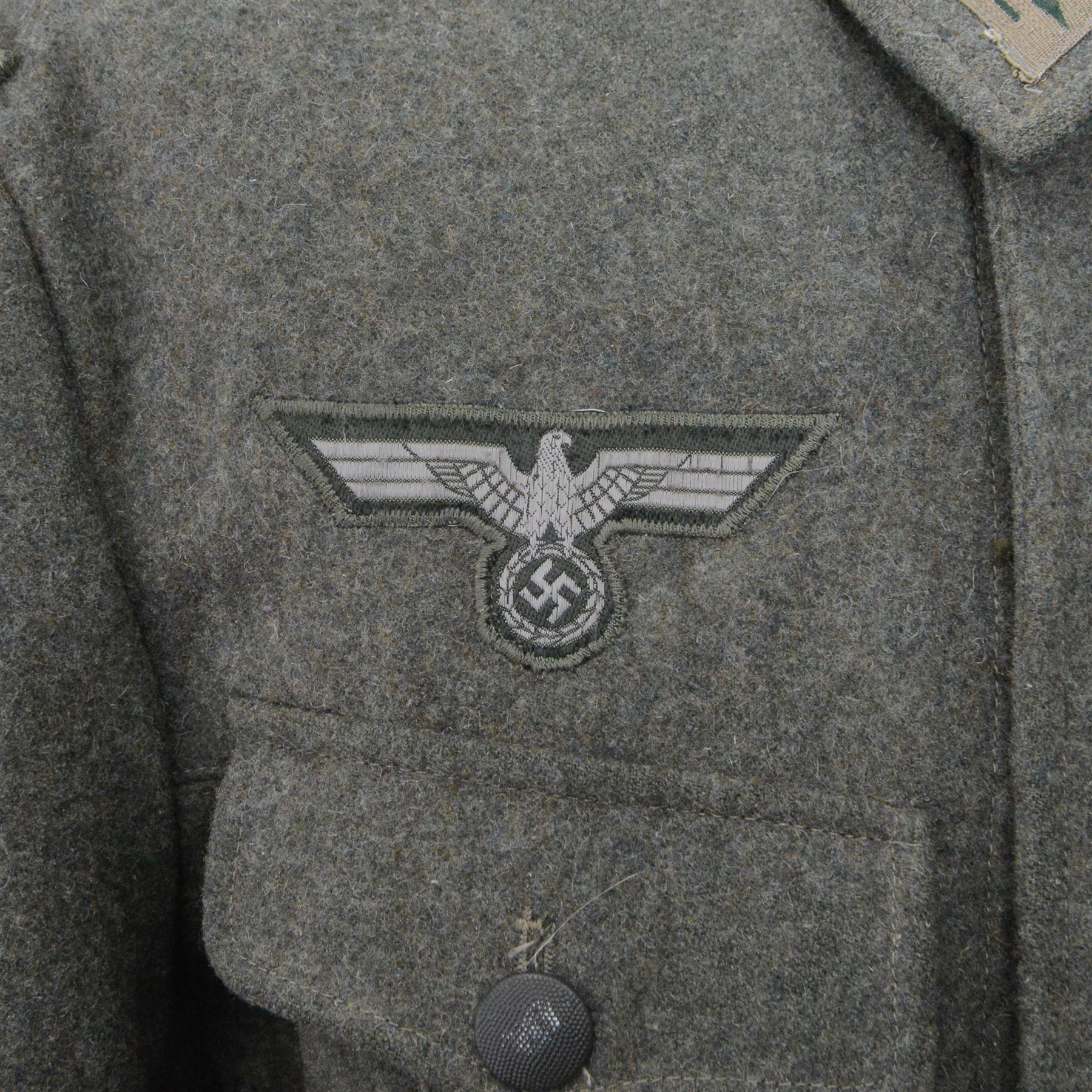 WWII German Third Reich field tunic, with Edelweiss insignia to the sleeve, eagle with swastika and collar tabs 