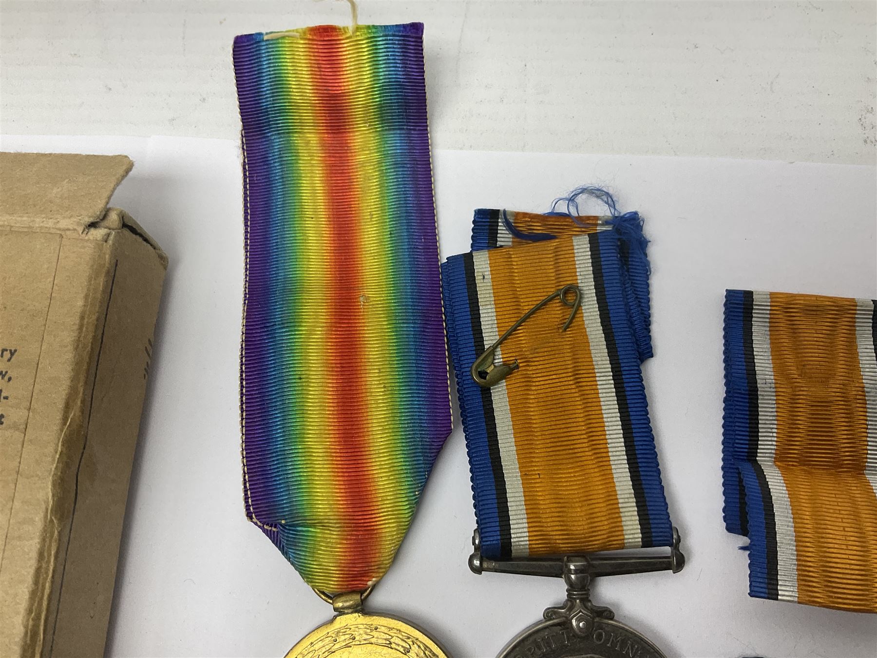 WWI pair of medals comprising British War Medal and Victory Medal awarded to 32682 Pte. W. Meadows W. Rid. R. in issue box; WWI pair of medals comprising 1914-15 Star and Victory Medal awarded to 3720 Pte. (later Cpl.) E. Petty W. York. R. with issue letter from Tank Corps; WWII group of five medals comprising 1939-45 War Medal, Defence Medal and 1939-45, Italy and Africa Stars; all with ribbons; and book of nineteen seaman's Certificates of Discharge to cook Charles Filburn 1893 - 1901 from various British ports