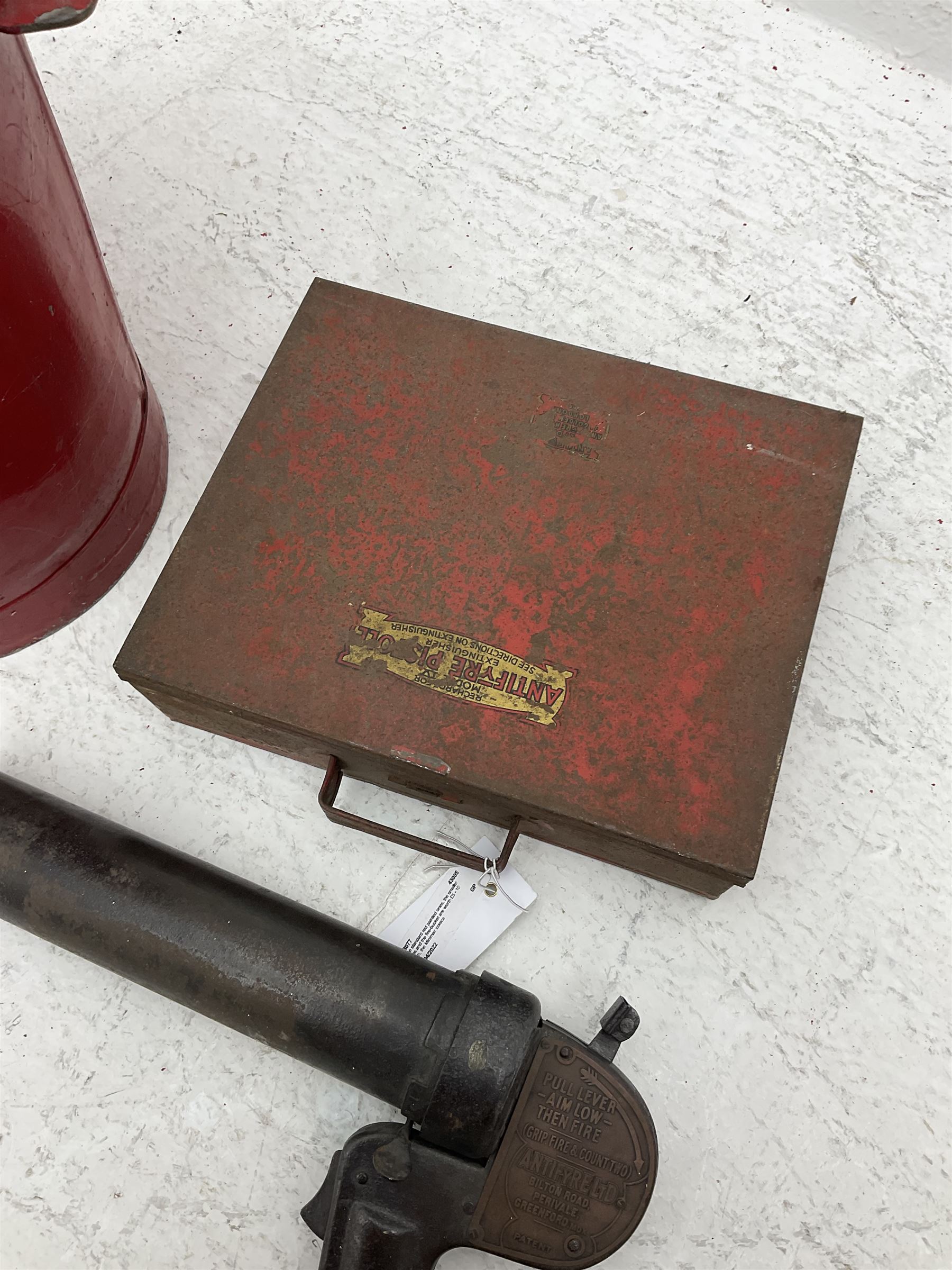 Antifyre Pistole fire extinguisher grenade launcher together with four cartridges (one lacking contents) in original storage tin, together with a red painted fire bucket
